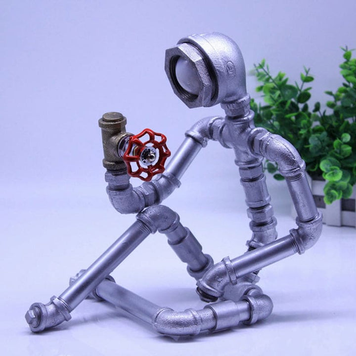 LightCraft – Industrielles Nachttischlicht „Pipe Man“ aus Eisen